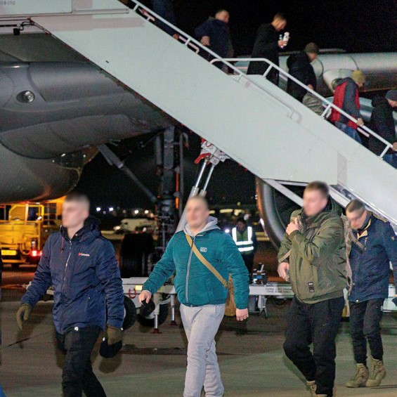 Image shows civilians departing RAF Voyager aircraft.